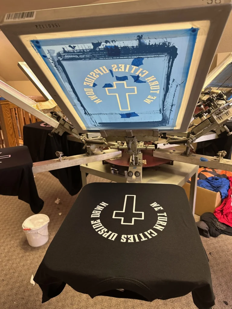 custom white ink screen print on-press at The Print Plug in Nampa