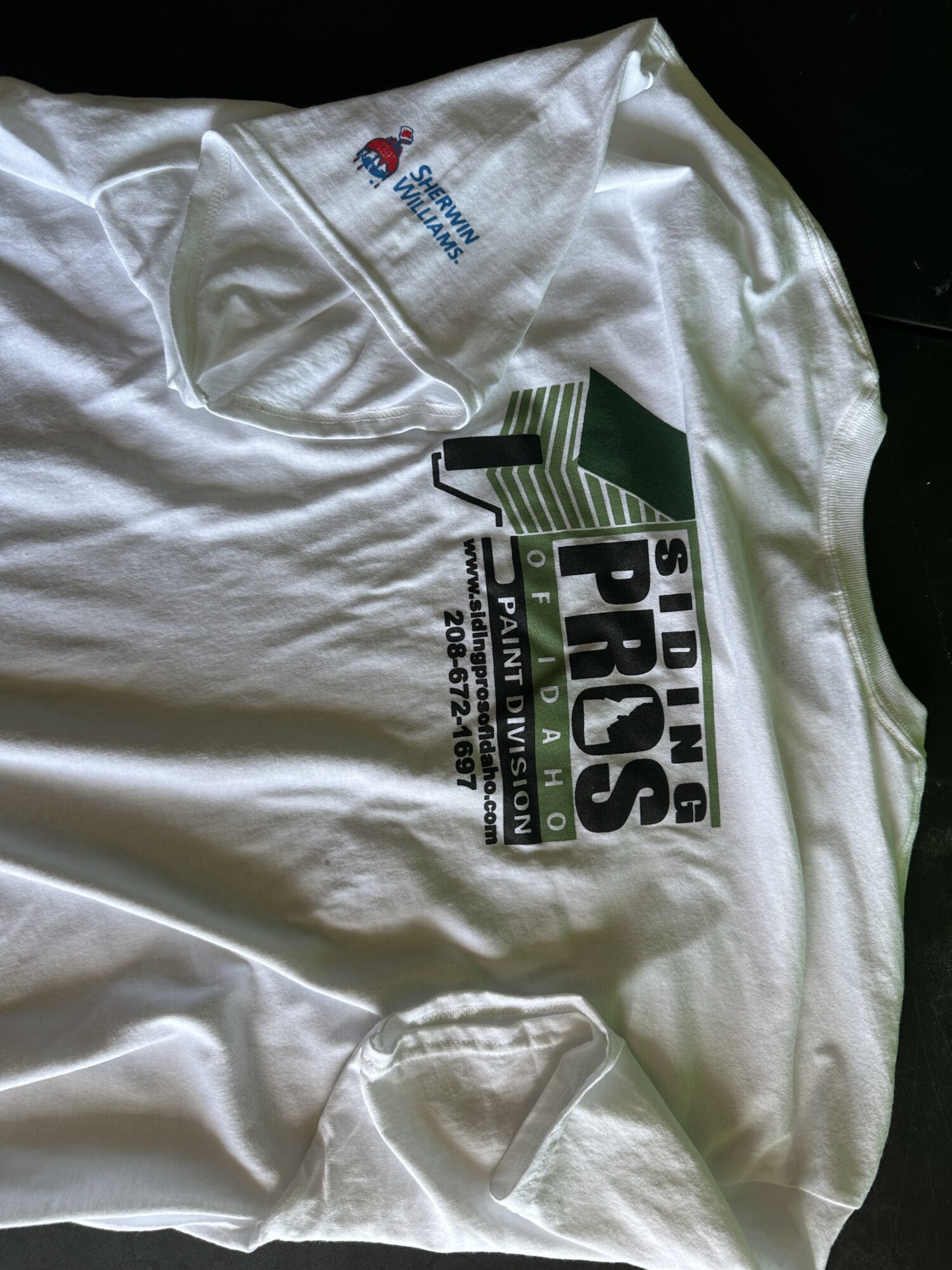 Custom 4 color screen printed t-shirt with sleeve placement for siding company in Nampa