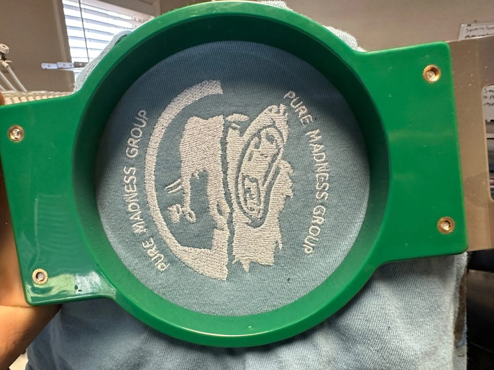 Custom white logo embroidery for a company based in Nampa, Idaho