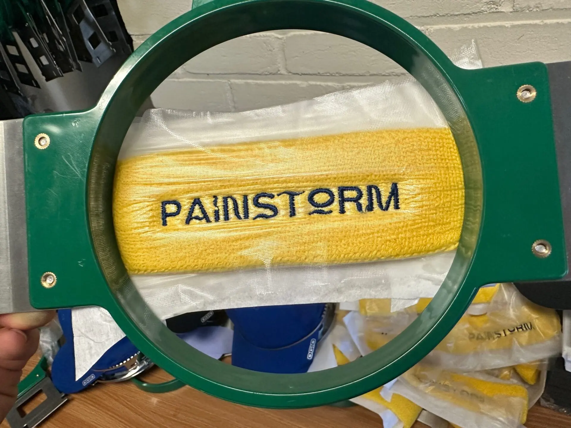 Customized sweat bands with embroidered design across the face