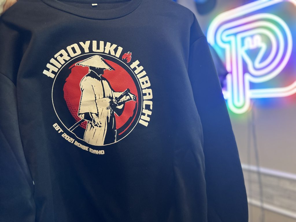 A bold 2 color custom screen printed sweater done at The Print Plug.