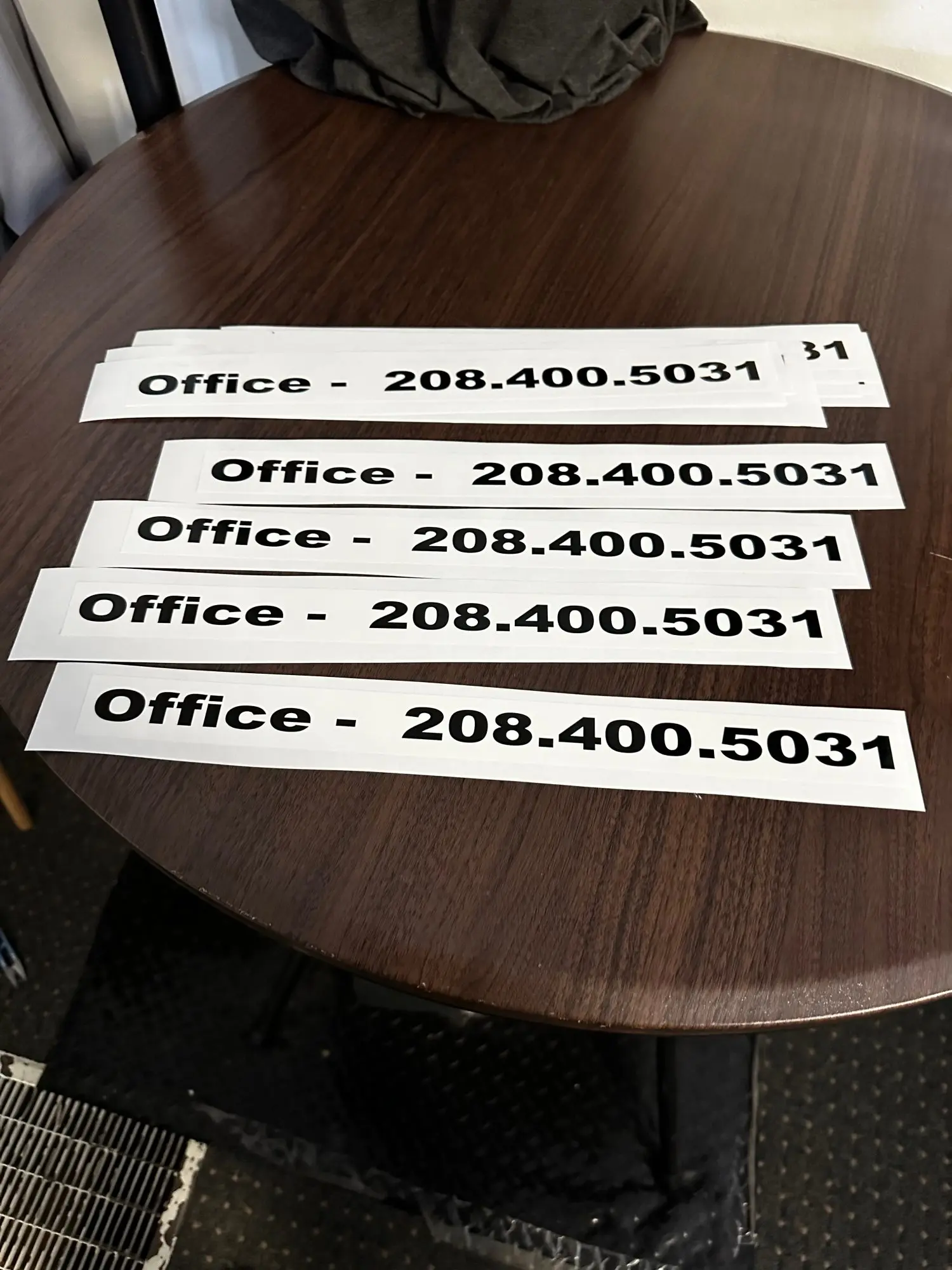 Custom stickers with phone number and business information at The Print Plug