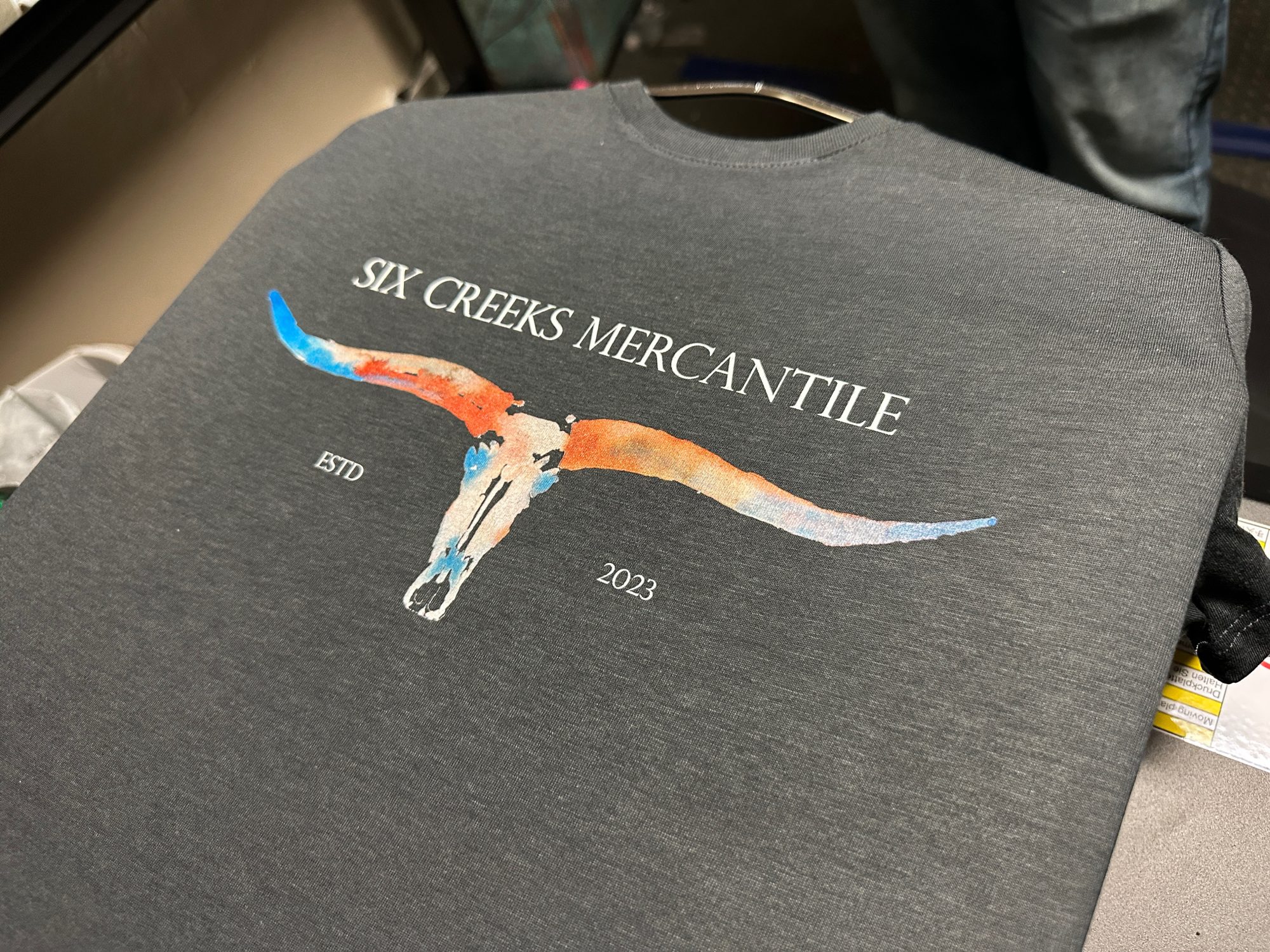 Custom graphic tee with watercolors made by DTG printing at The Print Plug in Nampa