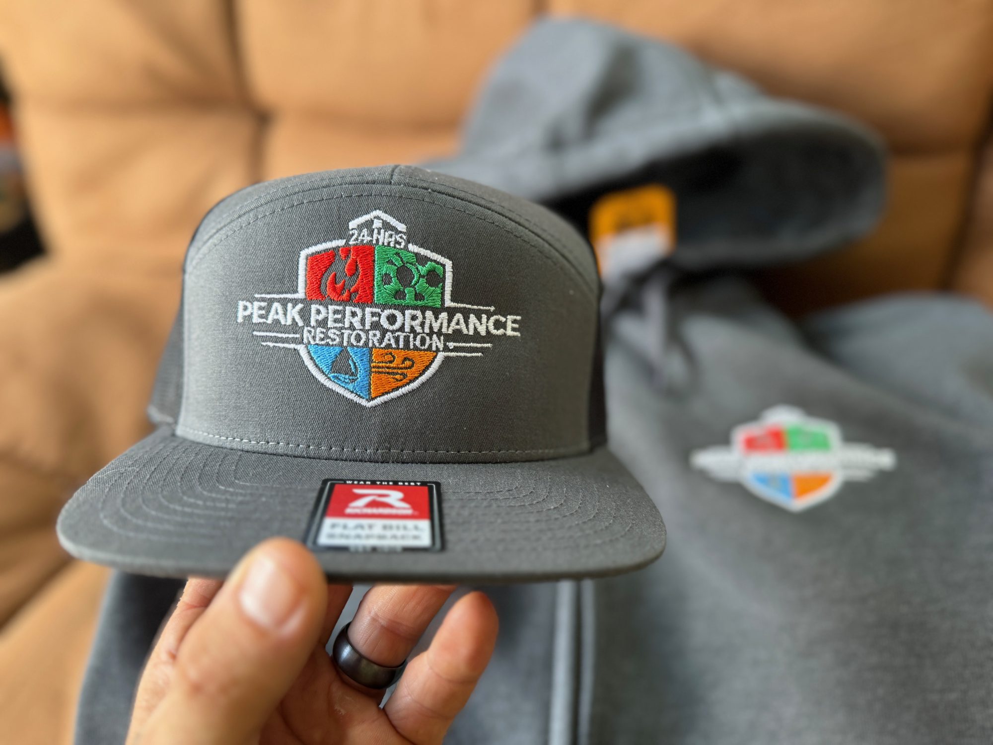 Custom embroidered hat with a custom embroidered hoodie for local business near Nampa