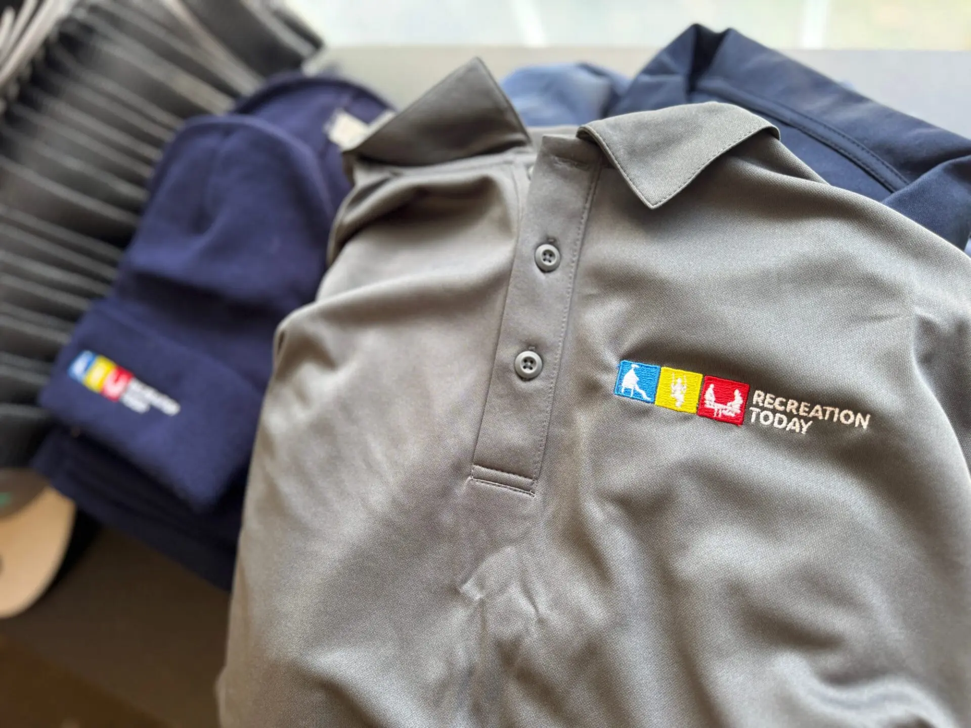 Custom embroidered polo shirts with logo embroidered on left chest for a local construction company near Nampa
