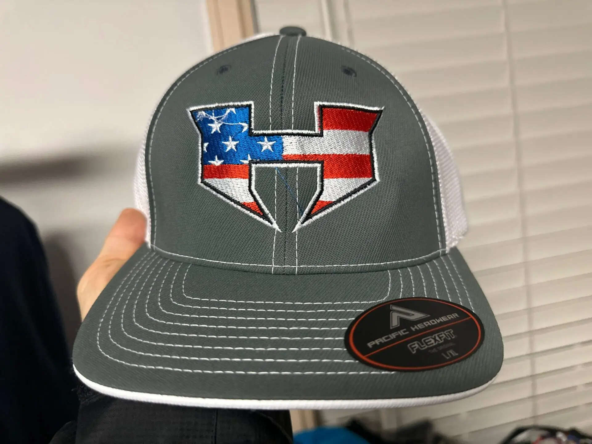 Custom embroidered hat with american flag colors for a local gaming company near Nampa