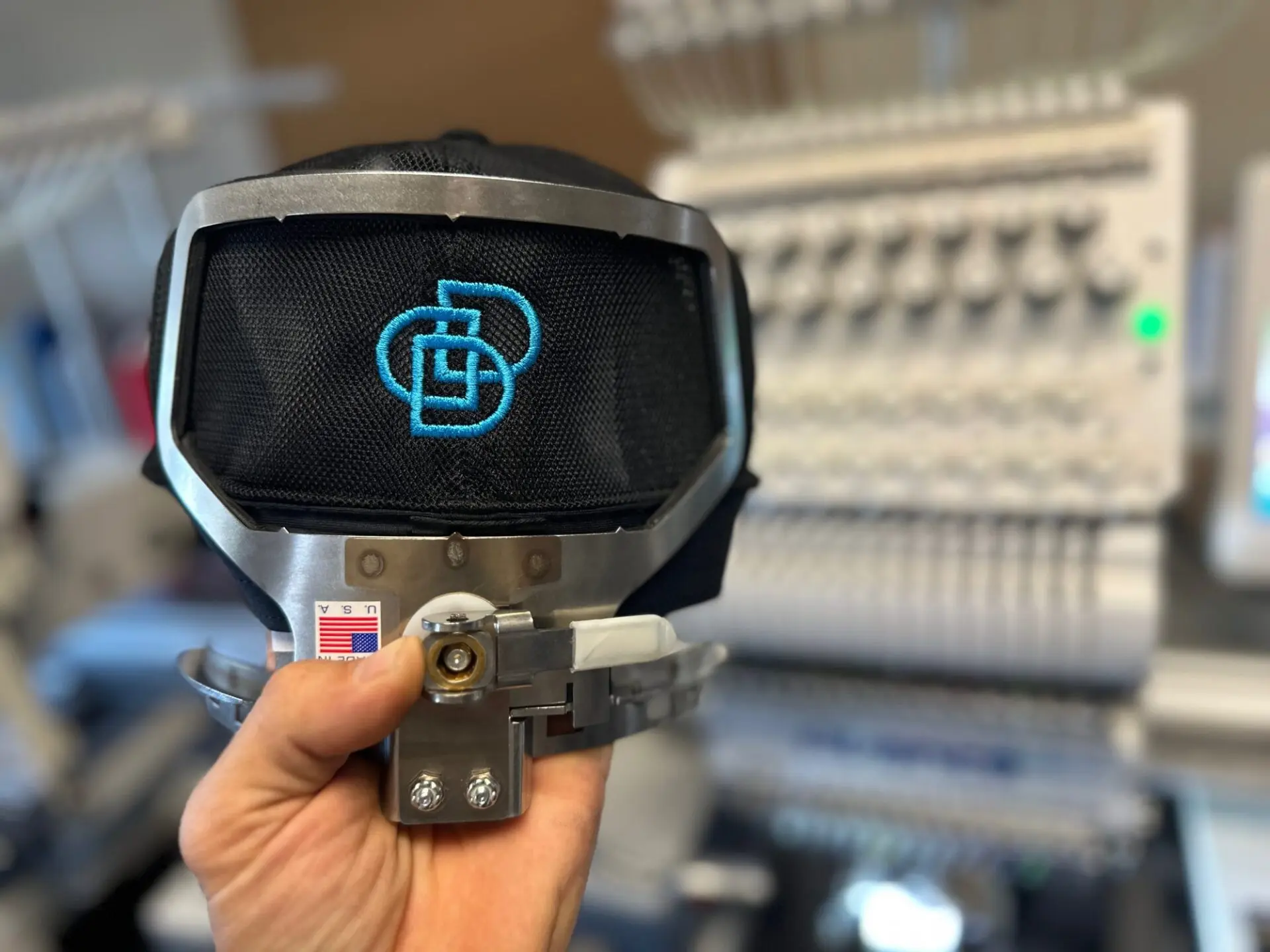 Logo custom embroidered onto back of a hat for a local business in Nampa