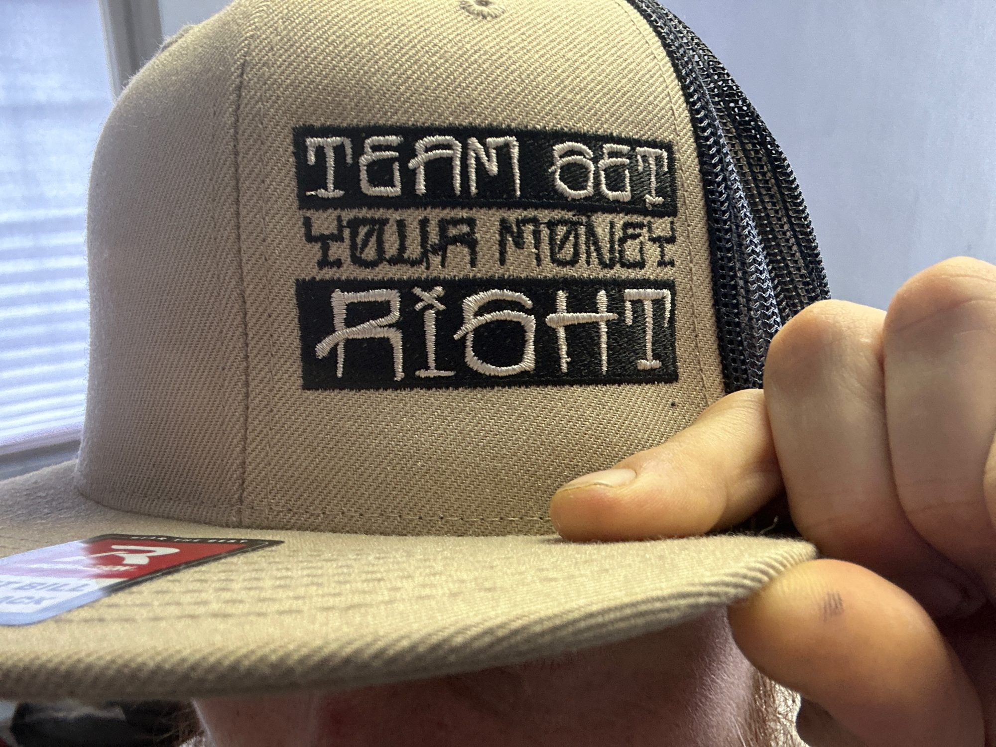 Custom embroidered hat with logo embroidered on the front left panel
