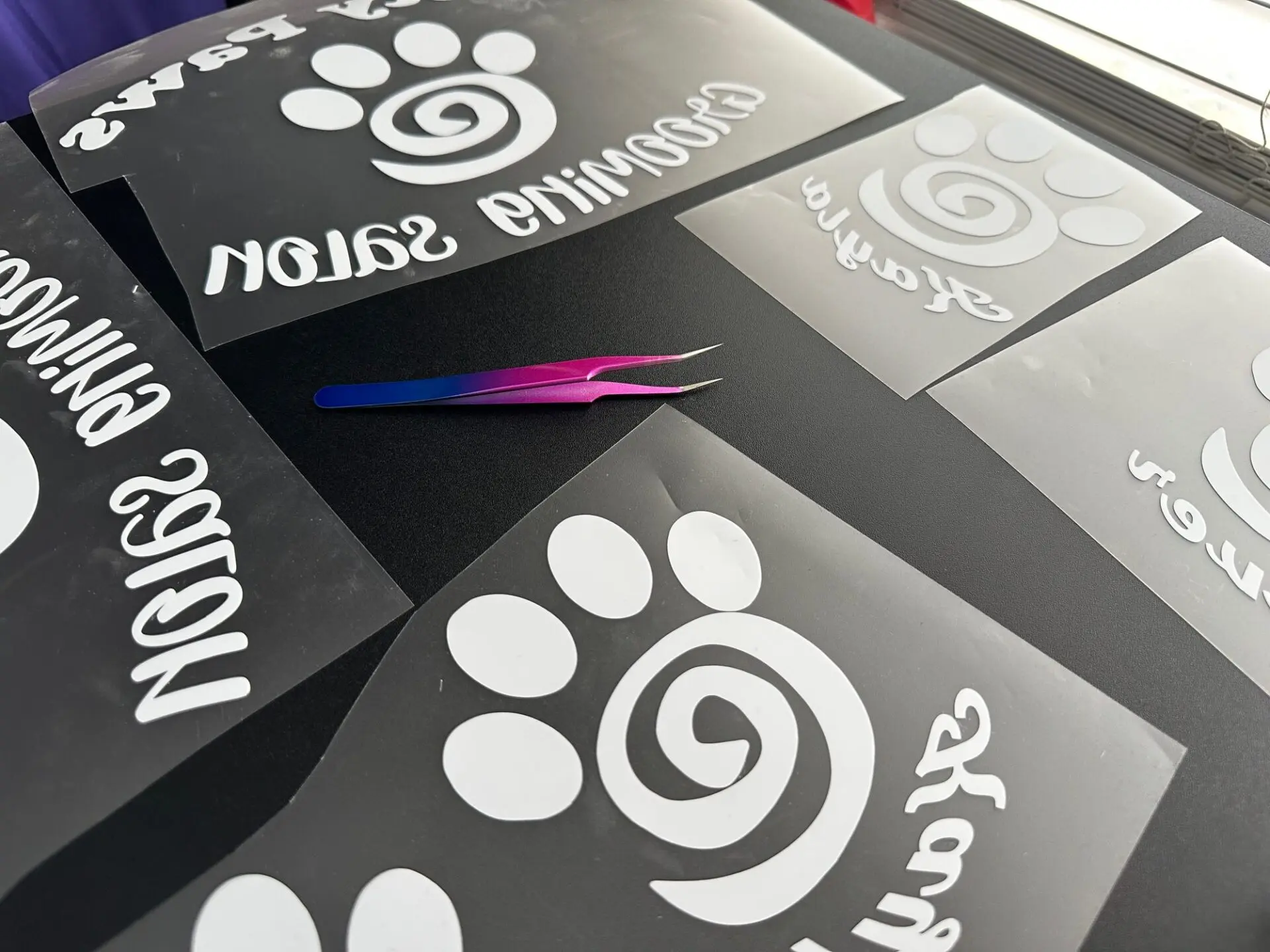 Custom HTV prints ready to be applied to custom vinyl shirts at The Print Plug in Nampa