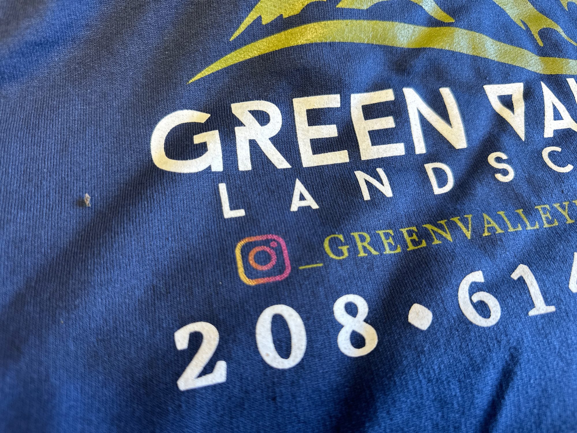 Close up of a custom screen printed t-shirt logo including gradient images