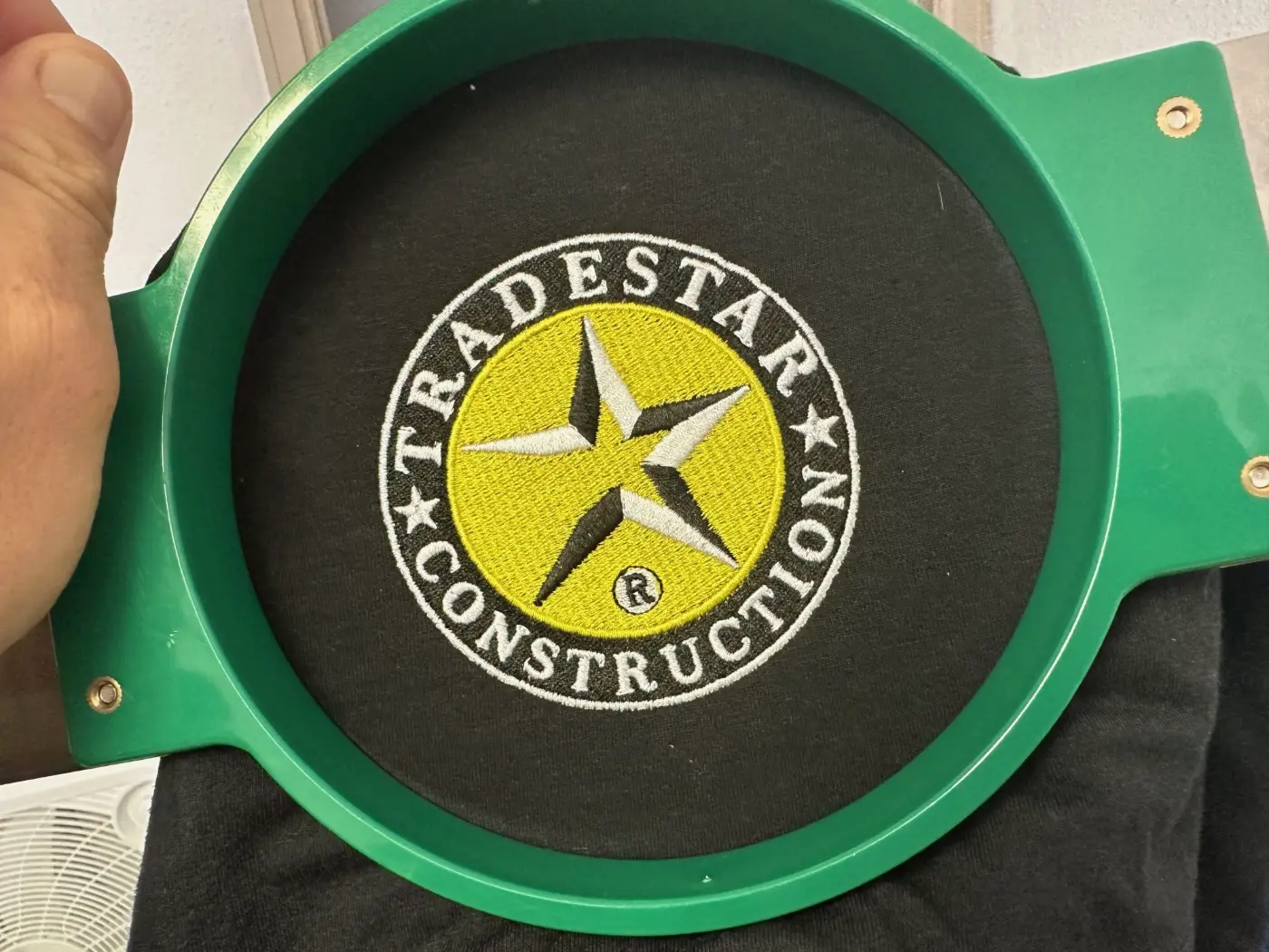 Small business logo embroidered in simple colors