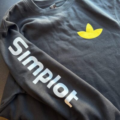 Custom screen printed shirts with left chest and sleeve placement for a large company in Nampa