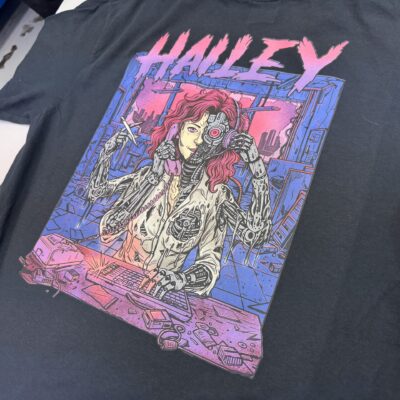 Close up a DTF printed graphic on a dark t-shirt showing bright and vivid colors