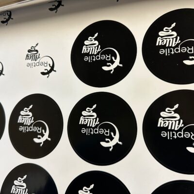 Custom stickers being printed in bulk for a local business owner near Nampa