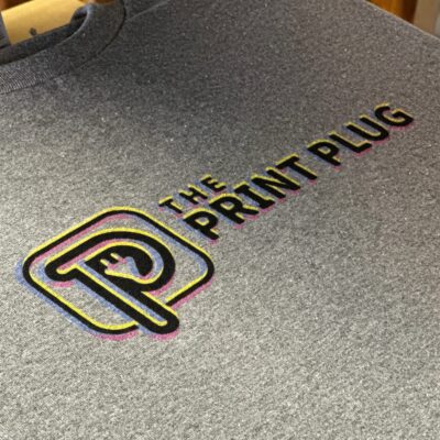 The Print Plug company logo printed onto a custom graphic tee by DTG printing