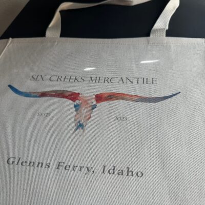 Custom DTG printing onto a handbag for a local company in Nampa
