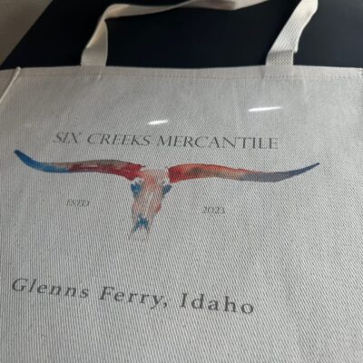 Custom DTG printing onto a handbag for a local company in Nampa