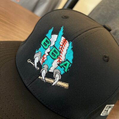 Custom embroidered hat for a local sports team from The Print Plug embroidery shop