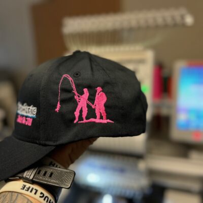 Custom embroidered hat with fishing design embroidered onto the side for a gift in Nampa