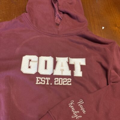 Custom embroidered hoodie with front chest and sleeve placement in Nampa