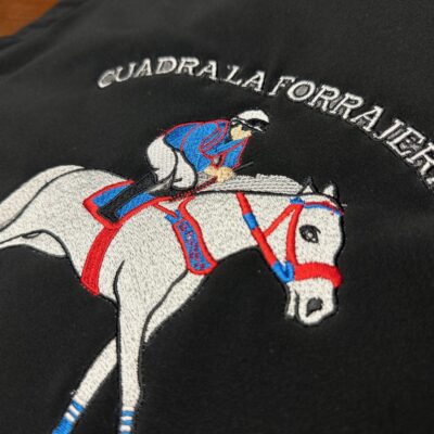Custom embroidered jacket with large back placement from The Print Plug embroidery shop in Nampa