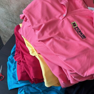 Custom embroidered polos with company logo embroidered in bulk at The Print Plug in Nampa