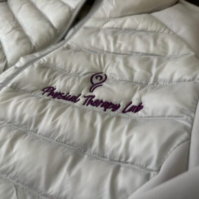 Custom embroidered jacket with company logo embroidered on the left chest