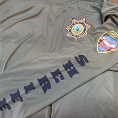 Custom HTV print on t-shirt with front placement and left sleeve for Nampa law enforcement