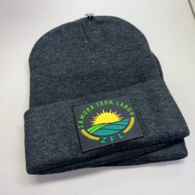 Custom dark beanie with PVC patch from The Print Plug