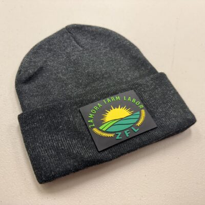 Dark beanie with PVC patch pressed on in Nampa