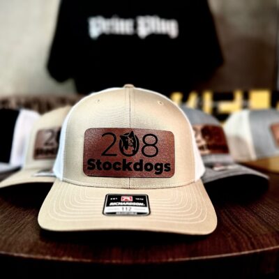 Custom leather patches on baseball hats made by The Print Plug