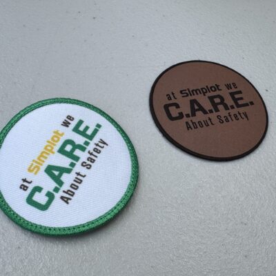 Close up of two custom patches made at The Print Plug