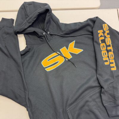 DTF hoodie with yellow print on a dark garment and front chest and sleeve placement