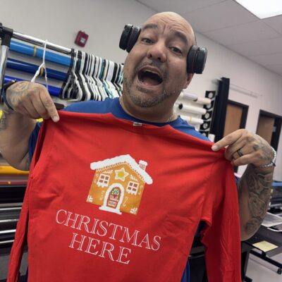 Showing off a Christmas t-shirt at The Print Plug