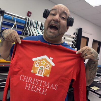 Showing off a Christmas t-shirt at The Print Plug