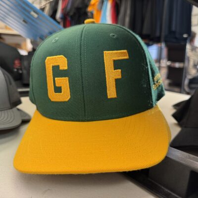 Custom embroidered baseball hat for local youth sports program