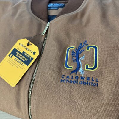Custom embroidered logo on left chest of jackets for a local school