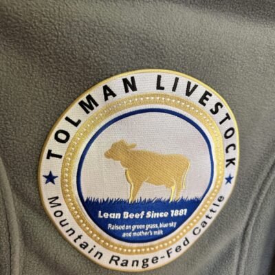 Custom logo embroidered onto the back of a shirt
